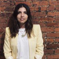 Sara Garzon in front of brick wall
