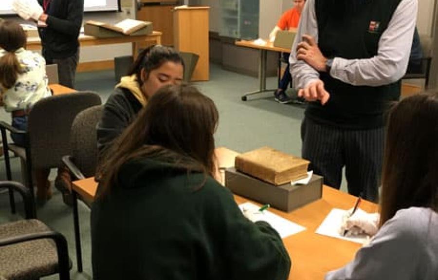 Students studying medieval manuscripts