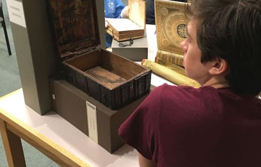 Students studying medieval manuscripts